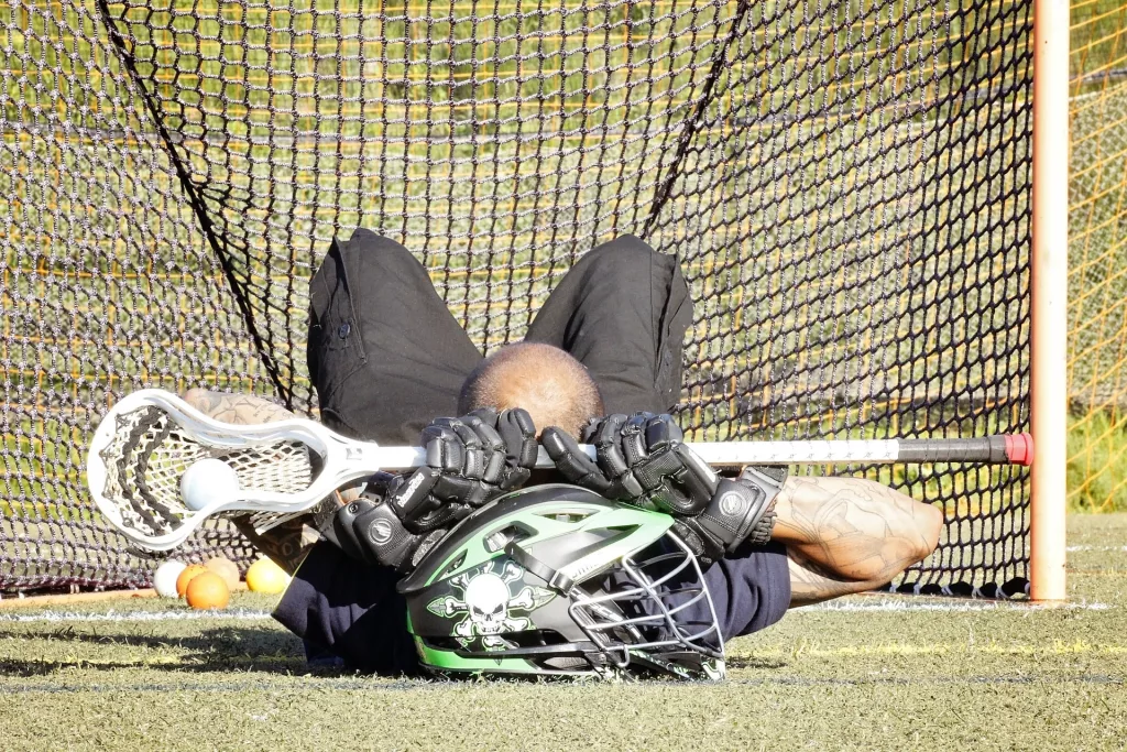 lacrosse player taking a rest