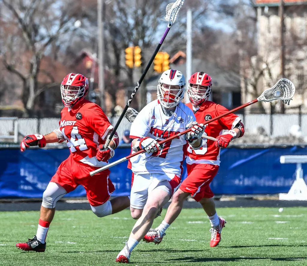 lacrosse players running during playing